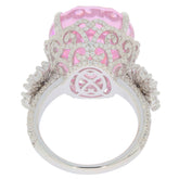 Elegant oval pink sapphire sterling silver ring, featuring intricate design and sparkling accents, showcasing luxury and beauty.